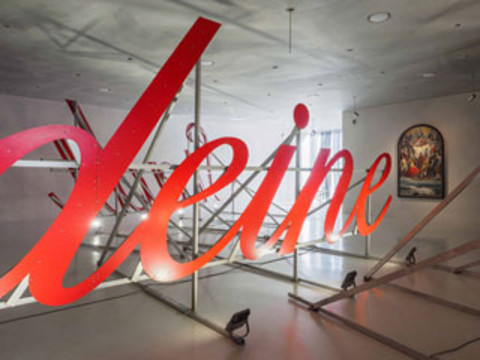 A photo of an oversized letter work in red with the word "yours".