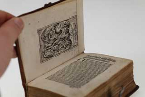 Photo of a small historical book.
