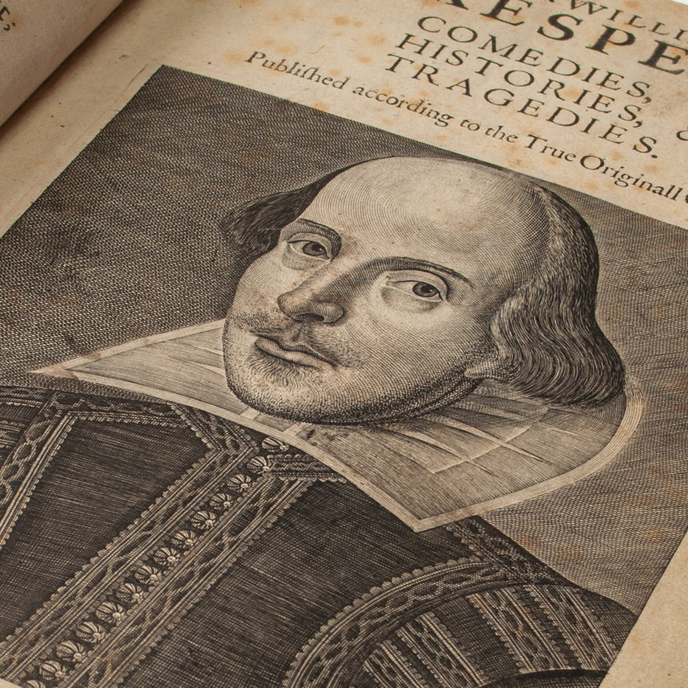 The title page of the First Folio. Pictured is a portrait of Shakespeare.